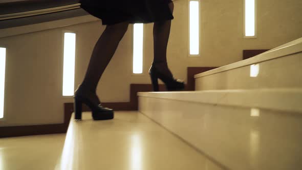 Young Woman Up the Stairs in Hotel, View of Feet in Shoes, Business Trip, Motion Tracking Camera