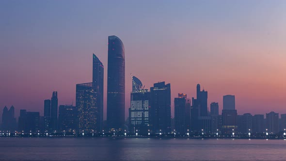 Abu Dhabi City Skyline at Sunrise Night To Day Transition