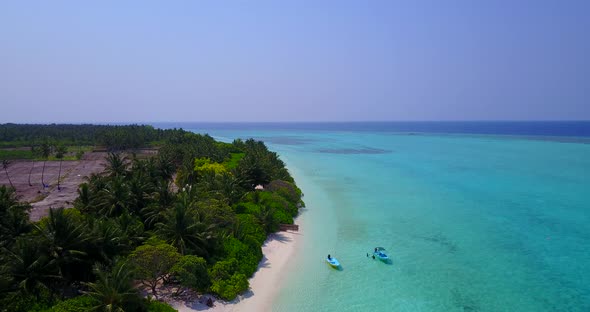 Wide angle fly over abstract shot of a sandy white paradise beach and turquoise sea background in hi