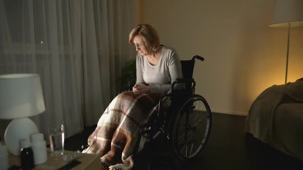 Upset Lady in Wheelchair Thinking About Children, Abandoned Patient Nursing Home