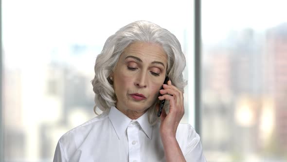 Portrait of Mature Woman Talking on Phone