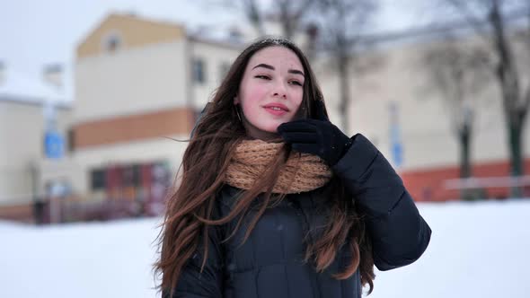 Portrait of a Young Girl in the Winter in the City