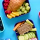 Shot of School Lunchboxes with Various Healthy Nutritious Meals on Blue Background - VideoHive Item for Sale
