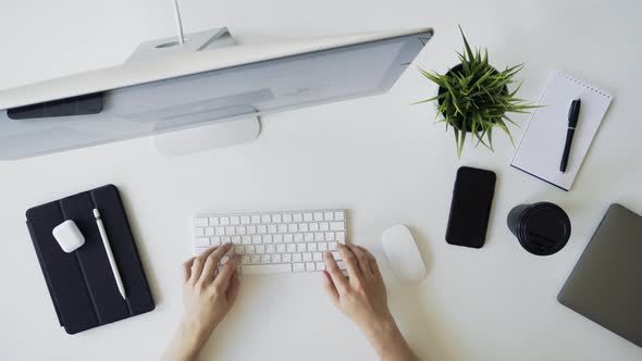 Male Hands Working on White Clean Desk in Office or Home