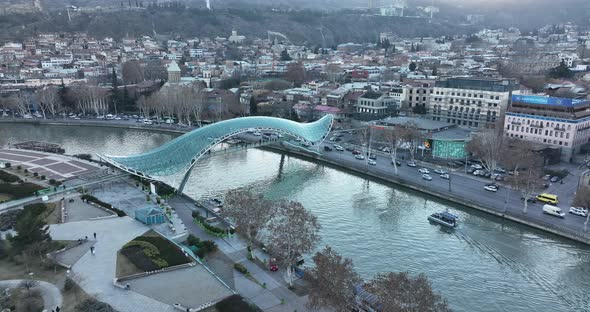 Aerial view of Tbilisi city central park and Bridge of Peace. Beautiful cityscape of old Tbilisi