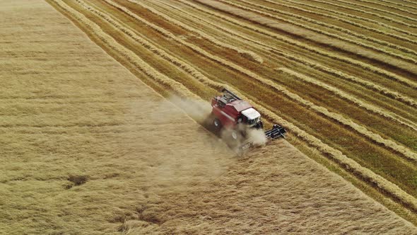 Red Harvester Harvesting Grain Crops