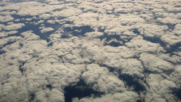 Overfly group of clouds seen from above. Aerial top down