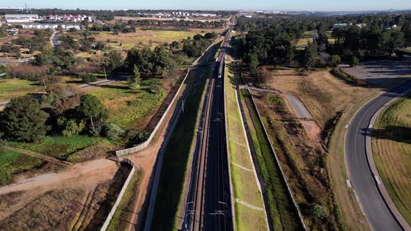 The Gautrain, along its journey to OR Tambo Airport, passes by below.