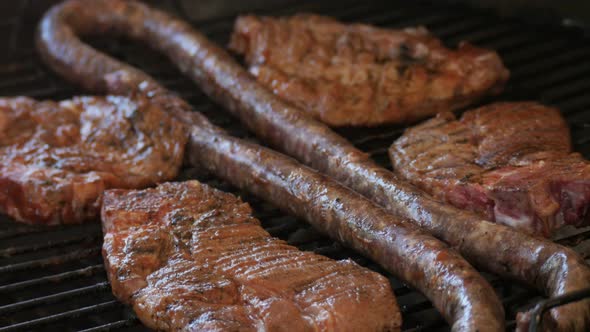 Traditional South African barbecue with chops and sausage CLOSE UP
