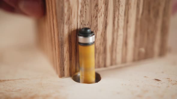 Close Up of Craftsman Hands Sanding the Surface of Handmade Wooden Box with Abrasive Paper Man