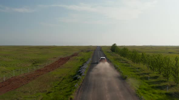 Aerial View Flying Towards Adventurous Car Driving on Ring Road a National Road That Runs Around