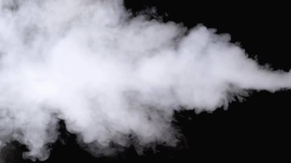 Water Vapor. White Jet of Vapour Steam on Black Background. Slow Motion