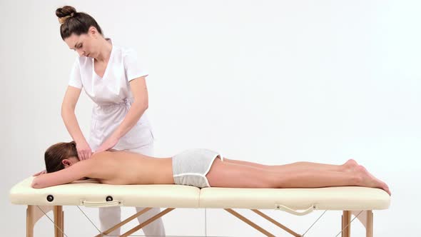 Salon neck massage for relaxation. Action. Professional restorative massage of neck