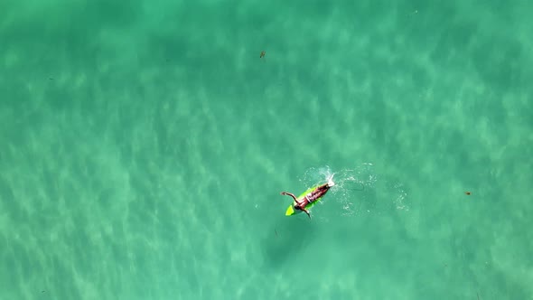 perfect relaxing surf scene.  A must-see slow motion to normal frame rate increasing altitude emeral