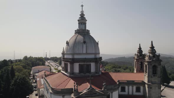 Aerial orbiting Portuguese Historic Sanctuary dome and bell tower, Sameiro - Braga alt