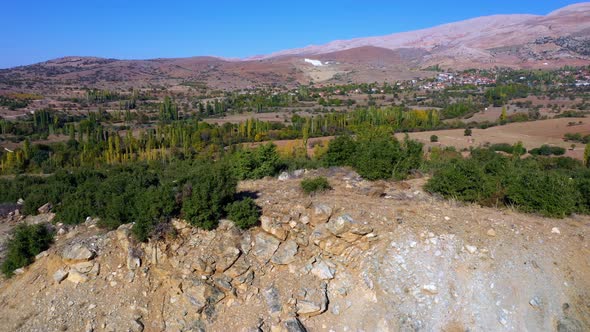 Scenic Aerial View of Mountain Valley with Agricultural Fields