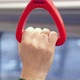 Close Up View of Male Hand Holding Looped Handle in Urban Public Transportation - VideoHive Item for Sale