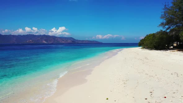 Aerial top down texture of paradise seashore beach holiday by blue ocean with white sand background 