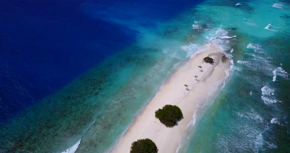 Wide angle flying abstract view of a sunshine white sandy paradise beach and turquoise sea backgroun