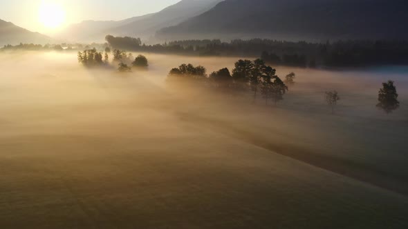 Drone Over Ethereal Misty Landscape Of Zell Am See At Dawn