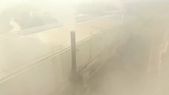 Aerial view of factory with pipes with white smoke emission 02