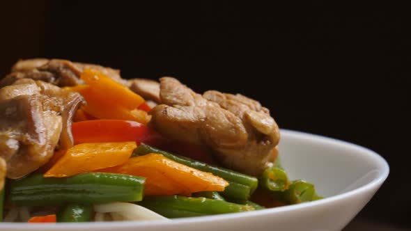 Thai noodles in a plate close up rotation. Ready serving dish on a rotating plate. restaurant food