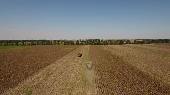 Flying Over Tractor And Combine Harvester