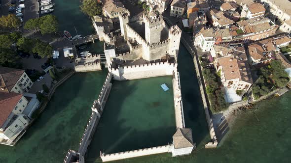 Aerial view of Castello Scaligero along Sirmione coast, Lombardy, italy.