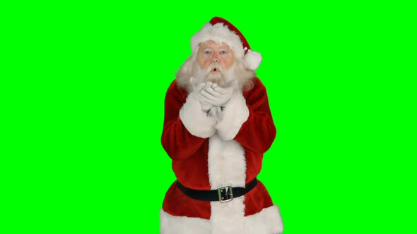 Portrait of santa claus giving flying kiss