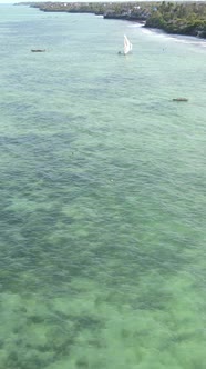 Vertical Video Boats in the Ocean Near the Coast of Zanzibar Tanzania