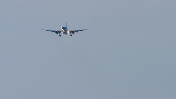 Airplane Approaching Over Ocean