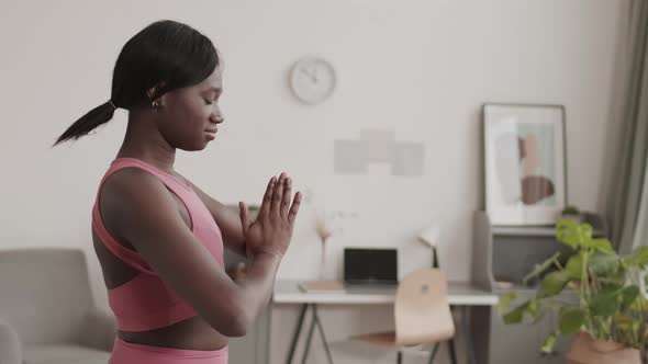 Young African-American Yogi Practicing Yoga at Home