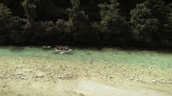 Aerial view of a group of people rafting in Soca river, Slovenia.
