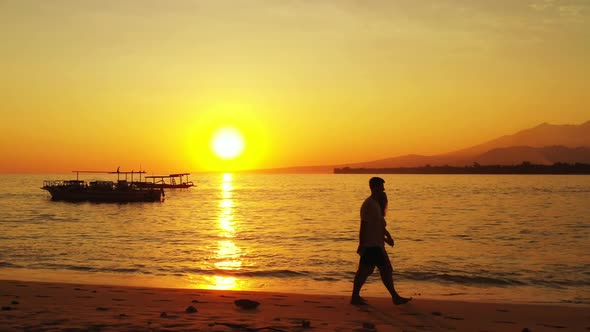 Two lovers suntan on paradise seashore beach holiday by clear sea and white sandy background of Gili