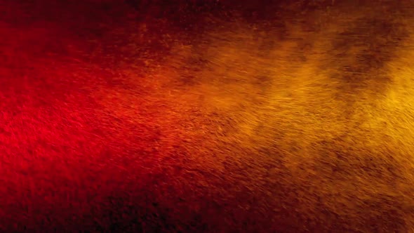 Red and Yellow Water Spray Mixed on a Black Background. Slow Motion