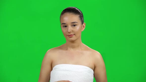 Cute Girl in a White Towel Was Suddenly Frightened Then Sighed in Relief on Green Screen at Studio