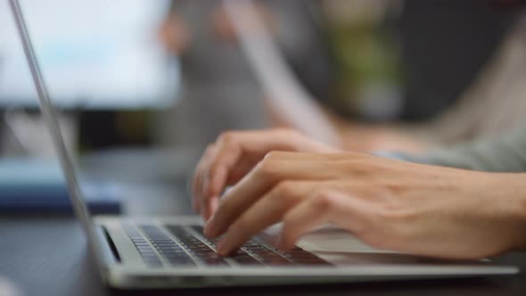 Male Hands Typing On Keyboard