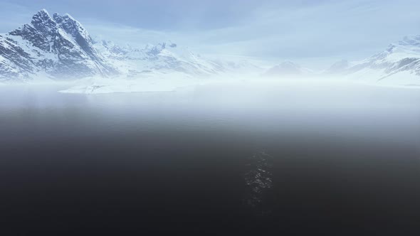 Blue Ice Covered Mountains in South Polar Ocean