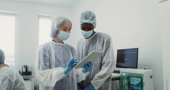 A Team of Laboratory Technicians Work in a Modern Wellequipped Laboratory