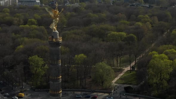 AERIAL: Wide View Circling Around Berlin Victory Column Golden Statue Victoria in Beautiful Sunlight