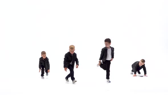 Kids Are Dancing a Modern Dance on the White Background in Black Leather Jackets and Jeans. Slow