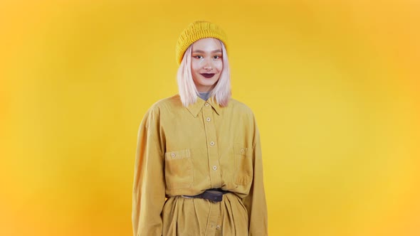 Young Curly Woman in Total Trendy Yellow Look. Portrait Flirting Beautiful Girl