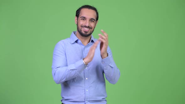 Young Happy Bearded Indian Businessman Clapping Hands