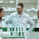 Team of pharmacist chemist woman and man standing in pharmacy - VideoHive Item for Sale