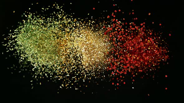 Super Slow Motion Shot of Colorful Seasoning Explosion on Black Background at 1000Fps.