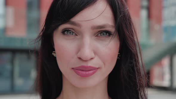 Closeup Portrait of Attractive Young Business Woman 30 Years Old Looking at Camera in the City Urban