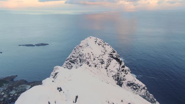 Drone Over Peak Of Snowy Mountain Reinebringen