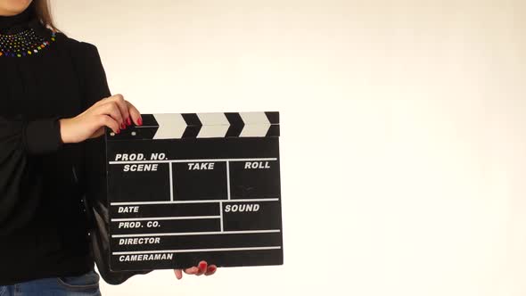 Woman Uses Movie Clapper Board, on White