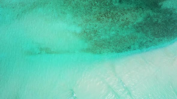 Aerial drone view travel of exotic bay beach adventure by blue ocean with white sand background of a