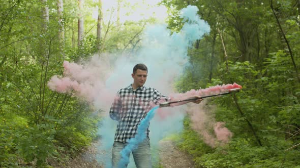 Male Juggling Colored Smoking Staff in Greenwood